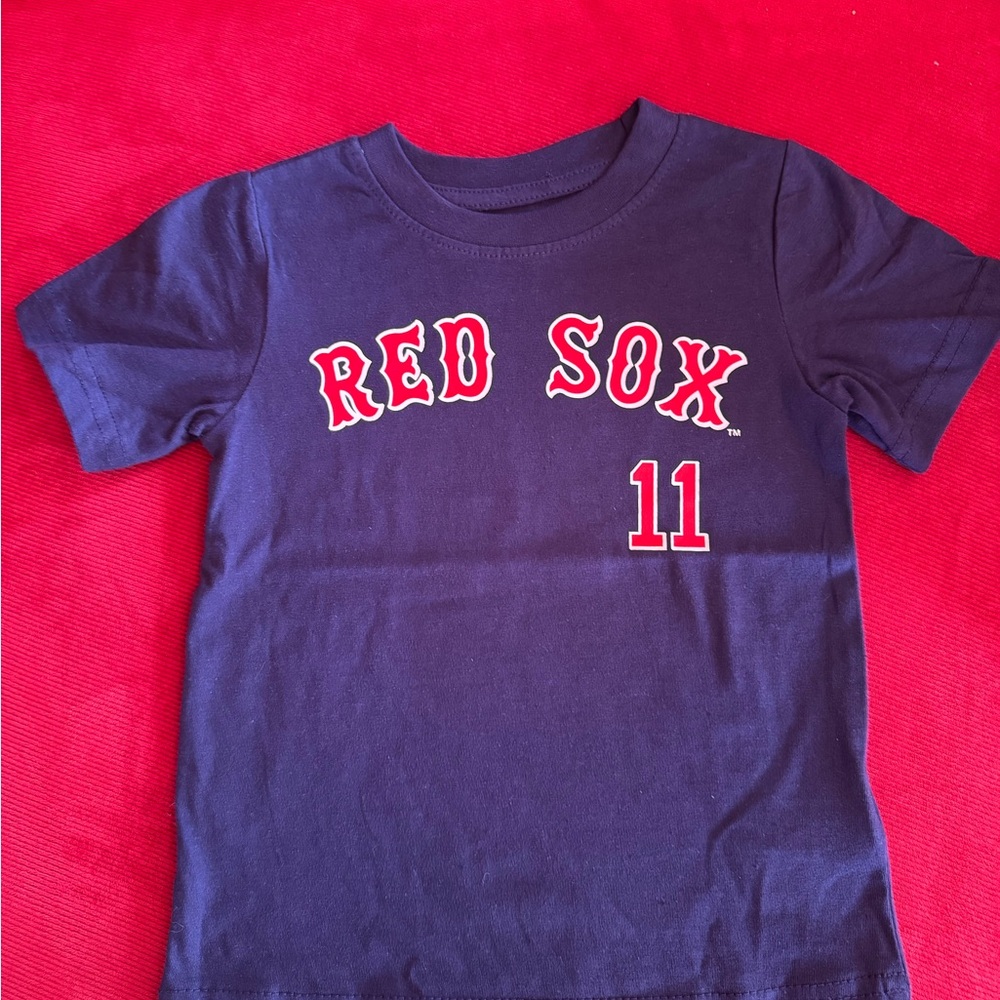 Genuine Merchandise Kids Tee in Navy with Red Print